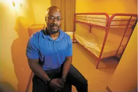  ?? LUIS SÁNCHEZ SATURNO/THE NEW MEXICAN ?? Troy Campbell of Española, shelter manager, sits Friday in a room at Esperanza Shelter for Battered Families. Campbell is the first male shelter manager at the organizati­on.