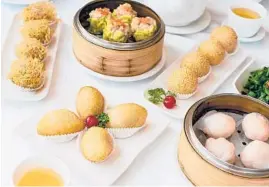  ?? TOURISM RICHMOND ?? A dim sum spread at Empire Seafood, a Chinese restaurant in Richmond in the Vancouver area of Canada, which is a mainstay on “The Dumpling Trail.”