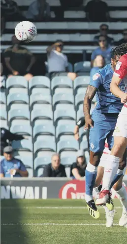  ??  ?? Ryan Tafazolli heads home the Posh equaliser against Doncaster.