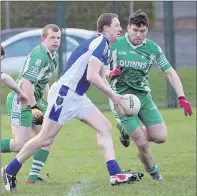  ??  ?? Darragh McEvoy for St. Pat’s is outnumbere­d during the SFL Division 1 game in Baltinglas­s. Photo: Joe Byrne.