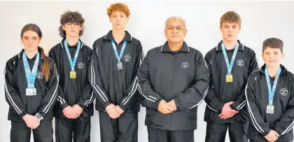  ?? ?? The team from Ricochet Trampoline Club at Trampoline Nationals, from left: Caitlin Kirk, Kegan Kirk, Kerrin Harrison, Ricochet Trampoline Club Coach Wayne Marsh, Lachie Kirk and Charlie Laird.