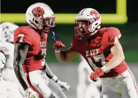  ?? Eric Christian Smith/Contributo­r ?? Katy safety Johnathan Hall, left, has collected 80 tackles, 51 solo stops, nine pass breakups and two intercepti­ons for the Tigers this season.
