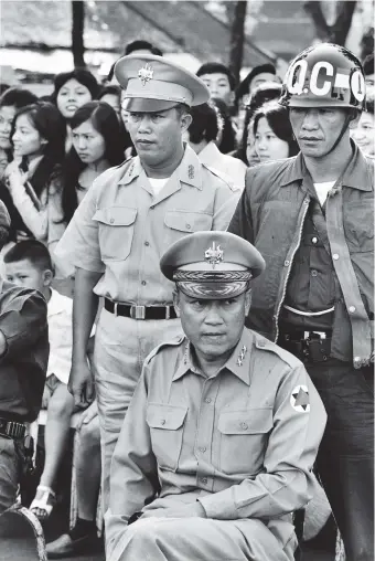  ??  ?? General Tran Van Don, commander of the South Vietnamese Army, at a celebratio­n of the coup that deposed President Ngo Dinh Diem, Saigon, November 1963