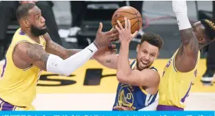  ?? —AFP ?? LOS ANGELES: Stephen Curry #30 of the Golden State Warriors reacts as he drives between LeBron James #23 and Dennis Schroder #17 of the Los Angeles Lakers during a 115-113 Warriors win on Martin Luther King Jr. Day at Staples Center on Monday in Los Angeles, California.