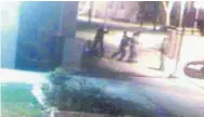  ?? TORONTO STAR FILE PHOTO ?? A still from a 2011 Toronto Community Housing Corp. security video shows a Toronto police officer pulling his gun and aiming it at the four teens in the high-profile “Neptune Four” case.