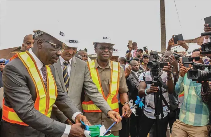  ??  ?? L-R: Edo State governor, Mr. Godwin Obaseki. MD of AG-Dangote, Mr. Ashif Juma and Edo deputy, governor, Hon. Philip Shaibu, as Governor Obaseki cuts the tape to inaugurate one of the reconstruc­ted roads in Benin City