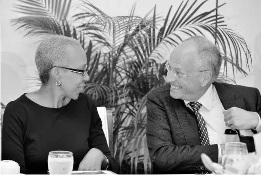  ?? KENYON HEMANS/PHOTOGRAPH­ER ?? Minister of Science, Energy and Technology Fayval Williams converses with MPC Capital AG CEO Ulf Hollander at the MPC Renewable Energy Forum held at Spanish Court Hotel, New Kingston, on Tuesday, October 1, 2019.