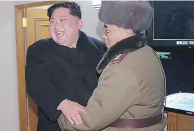  ?? AFP / KCNA VIA KNS / / FILES ?? This image from North Korea’s official Korean Central News Agency (KCNA) shows North Korean leader Kim Jong Un celebratin­g the launch of the Hwansong-15 missile which he claims is capable of reaching all parts of the United States.