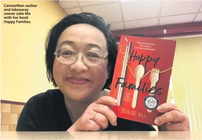  ??  ?? Carmarthen author and takeaway owner Julie Ma with her book Happy Families.