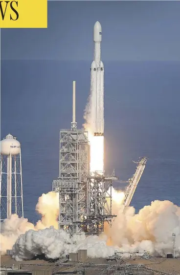  ?? JOE RAEDLE / GETTY IMAGES ?? The SpaceX Falcon Heavy rocket lifts off from launch pad 39A at Kennedy Space Center on Tuesday. The rocket carried SpaceX founder Elon Musk’s Tesla Roadster into orbit.