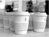  ?? ERIC RISBERG/AP ?? Reusable cups selling for $16 each are displayed at a Blue Bottle Coffee cafe in San Francisco.