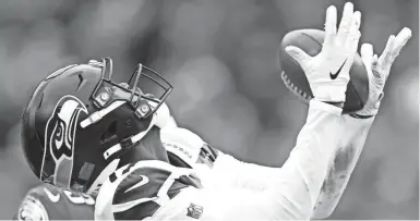  ?? GETTY IMAGES ?? Malik Turner catches a first-quarter touchdown pass for Seattle in 2019. The free agent joined the Green Bay Packers on Wednesday.