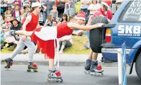  ?? Photo / Tania Whyte ?? Brigitte Legendre shows off her skills at last year’s Onerahi Santa Parade. The festive event is back this weekend.