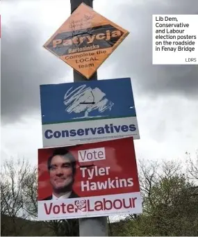  ??  ?? Lib Dem, Conservati­ve and Labour election posters on the roadside in Fenay Bridge
LDRS