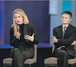  ?? Joshua Lott AFP/Getty Images ?? ELIZABETH HOLMES, shown in 2015 with Alibaba Group Executive Chairman Jack Ma, is accused of lying about the effectiven­ess of Theranos’ blood tests.