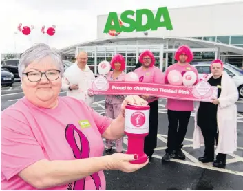  ??  ?? Digging deep Community champion Ann Binks (front) is leading the Tickled Pink campaign