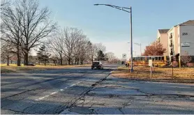  ?? Chris Churchill/Times Union ?? “We’ve almost been hit by cars over there many different times, just to get to the doctor's office,” said Jahrod Kirk about this access road near the Patroon Creek Corporate Center.