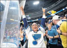  ?? ELSA/GETTY ?? St. Louis Blues fans celebrate a goal scored on the San Jose Sharks during the third period in Game 6 of the Western Conference Finals.