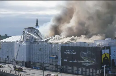  ?? EMIL HELMS — RITZAU SCANPIX VIA AP ?? Smoke rise out of the Old Stock Exchange in Copenhagen during a fire there Tuesday.