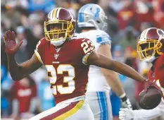  ?? — PATRICK SEMANSKY/AP FILES ?? The Seahawks’ Quinton Dunbar, seen above with the Redskins in 2019, has turned himself in to police over charges of armed robbery.