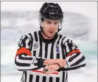  ?? MATTHEW MURNAGHAN/Hockey Canada ?? Former KIJHL referee Mike Langin works the recent World Junior Championsh­ips in Edmonton in this undated handout photo.