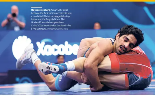  ?? UNITED WORLD WRESTLING ?? Optimistic start: Aman Sehrawat became the first Indian wrestler to win a medal in 2024 as he bagged the top honour at the Zagreb Open. The Under-23 world champion beat China's Zou Wanhao for the title in the 57kg category.