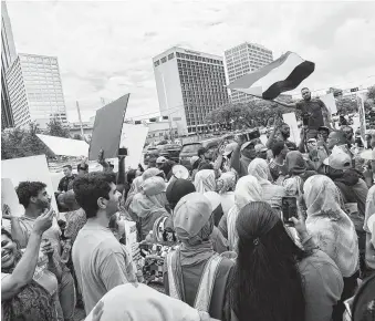  ?? Marie D. De Jesús / Staff photograph­er ?? Protesters carried signs to raise awareness of the ongoing political turmoil in Sudan. The event marked the 30th anniversar­y of the coup that brought former President Omar al-Bashir to power.