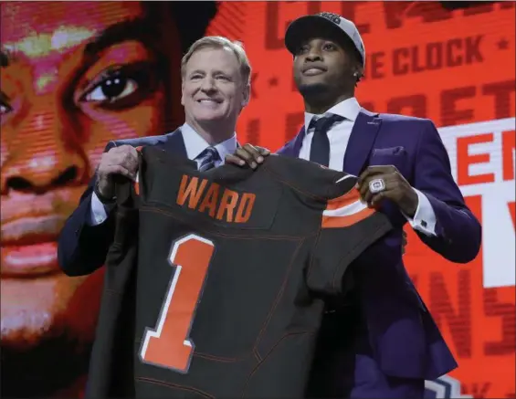  ?? DAVID J. PHILLIP — ASSOCIATED PRESS ?? Ohio State’s Denzel Ward poses with Commission­er Roger Goodell after being selected by the Browns on April 26 in Arlington, Texas.