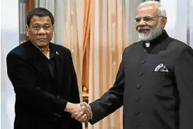  ?? —AFP ?? President Duterte and Indian Prime Minister Narendra Modi open talks on economic and military cooperatio­n at the AseanIndia Commemorat­ive Summit in New Delhi on Jan. 24.