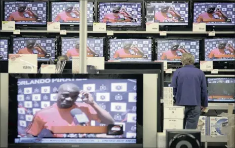  ?? PHOTO: BLOOMBERG ?? A customer browses electronic goods at a Game supermarke­t in Johannesbu­rg. An increase in the country’s VAT rate is said to be only a question of time.