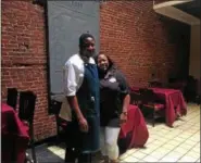  ?? PHOTOS BY MONICA SAGER — DIGITAL FIRST MEDIA ?? Owners Akiai Worthingto­n and Kwane Haywood stand inside their new restaurant in Pottstown — Welcome to the Avenue.