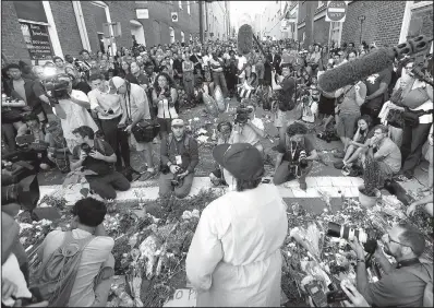  ?? AP/STEVE HELBER ?? Brittney Cain-Conley, lead organizer for Congregate Charlottes­ville, addresses the crowd during a vigil Sunday for the victims of Saturday’s attack in Charlottes­ville, Va.