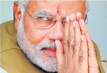  ??  ?? MODERATE: Narendra Modi was catapulted to power on promises to develop India’s economy and root out corruption and incompeten­ce, but radical Hindu elements in his party are not happy.