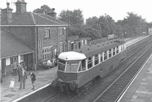  ?? TRANSPORT TREASURY ?? Photo opportunit­y: A young boy focuses his camera on something catching his eye as W20W waits at Woofferton Junction on the Shrewsbury to Hereford main line on an unrecorded date in the late 1950s or early 1960s. The GWR diesel railcar was saved for preservati­on after withdrawal in October 1962 and is undergoing a longterm restoratio­n at the Kent & East Sussex Railway.