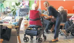  ??  ?? Staffer Chelsea Martens chats with Dorothy Gunn, 95, in the bright lounge.