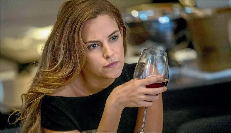  ??  ?? Riley Keough plays an ambitious young woman who acknowledg­es she’s trying to burn the candle at three ends in The Girlfriend Experience.