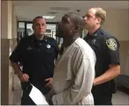  ?? CARL HESSLER JR. — MEDIANEWS GROUP ?? Darryl “Omar” McMillian, 37, of Pottstown, is escorted from Montgomery County courtroom after he was arraigned on murder-related charges in connection with the alleged April 16, 2019, fatal shooting of his roommate.