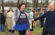  ?? EVAN BRANDT — DIGITAL FIRST MEDIA ?? Pottstown School Board member John Armato admires the shirt and tutu worn by Pottstown Mayor Stephanie Henrick before she jumped into the Schuylkill River for Pottstown’s 11th Annual Polar Bear Plunge.
