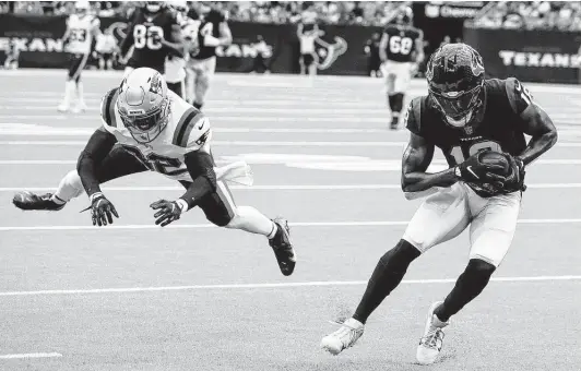  ?? Photos by Brett Coomer / Staff photograph­er ?? Texans receiver Chris Conley beats Patriots safety Devin McCourty for a 40-yard reception and a first down in the first half. Conley also had a 37-yard TD catch.