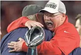  ?? CHRIS O’MEARA/AP ?? Chiefs coach Andy Reid receives congratula­tions from broadcaste­r Terry Bradshaw after Kansas City defeated San Francisco in Super Bowl LIV on Sunday in Miami Gardens, Fla.