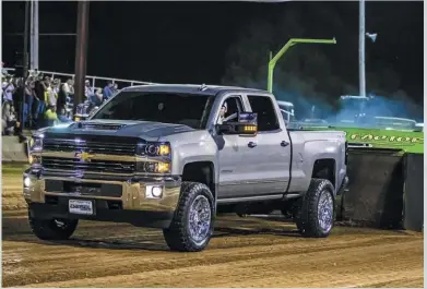  ??  ?? Back when the truck was closer to stock—though it still had a 63mm Danville drop-in VGT and hot tuning—colton hooked his Silverado to the sled. When he returns to the dirt this summer, his L5P will be packing four-digit horsepower and should move the iron sleigh much further and faster.