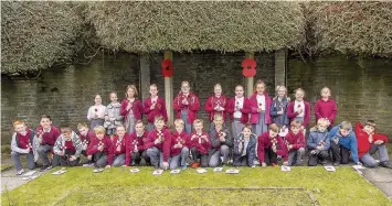  ??  ?? Pupils from Miskin and Caegarw primary schools helped launch the 2016 Poppy Appeal for Mountain Ash and opened a memorial garden