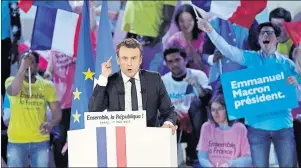  ?? AP PHOTO ?? French independen­t centrist presidenti­al candidate Emmanuel Macron speaks to his supporters during a campaign rally in Paris, France, Monday.