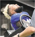  ?? Bill Kostroun / Associated Press ?? Giants wide receiver Odell Beckham grimaces while being carted off the field after breaking his left ankle.