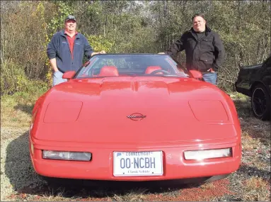  ?? Jo Ann Jaacks / For Hearst Connecticu­t Media ?? Joe Rebot, left, and Ken Might, both of Morris, pose with Might’s 1996 Chevrolet Corvette at the Morris Car Show.