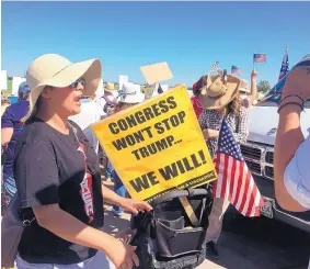  ?? ANGELA KOCHERGA/JOURNAL ?? New Mexicans were among hundreds of families who on Father’s Day protested the separation of children from their parents outside a “tent city” set up as a temporary shelter for immigrant kids.