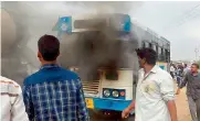  ??  ?? Smoke comes out of a Setwin bus at Shamshabad on Sunday