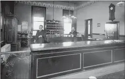  ?? Courtesy photos / Carlo M. De Ferrari Archive (above and below); courtesy art /Tuolumne County Historical Society (left) ?? A view of the county clerk and auditor’s office shortly after constructi­on was completed (above). A steam register painted gold is at the far left. An architect’s proposal for an eastern addition to the courthouse would have bulldozed half of Courthouse Square (left). Floors, steps and walls were out-of-bounds for spitters, who were encouraged to use one of many spittoons placed for their convenienc­e, including next to this directive posted at the second floor staircase (below).