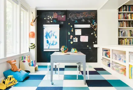  ?? JOYELLE WEST ?? Floor tiles are an ideal carpet choice for playrooms, said Mary Flo Ouellette of Squarehous­e Studios, because they’re hardwearin­g and it’s easy to replace individual tiles when necessary.