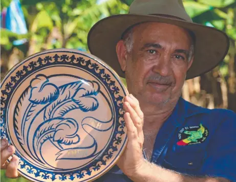  ?? STEP AHEAD: Banana farmer Frank Sciacca with his Prince of Wales Award for environmen­tal leadership. Picture: JOHN ANDERSEN ??